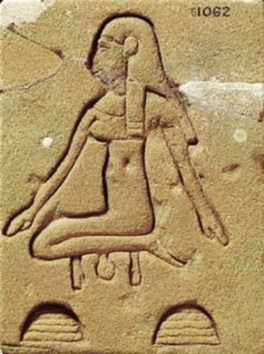 An Egyptian relief carving of a seated figure